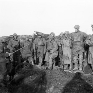 Men of the York and Lancashire Regiment, wearing camouflage suits, prepare for a trench raid near Roclincourt, 12 January 1918.